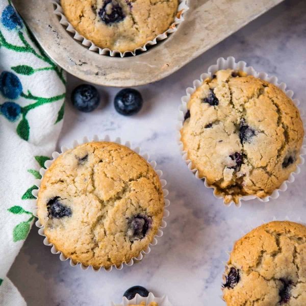 gluten-free blueberry muffins on white marble countertop