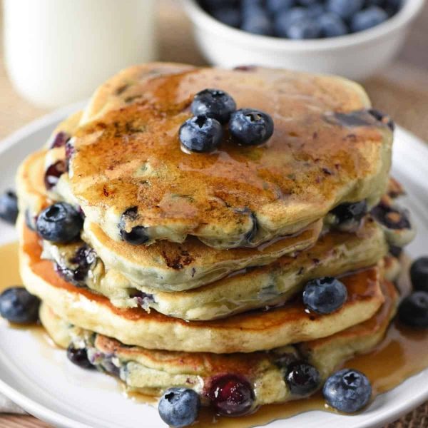 stack of blueberry buttermilk pancakes with maple syrup