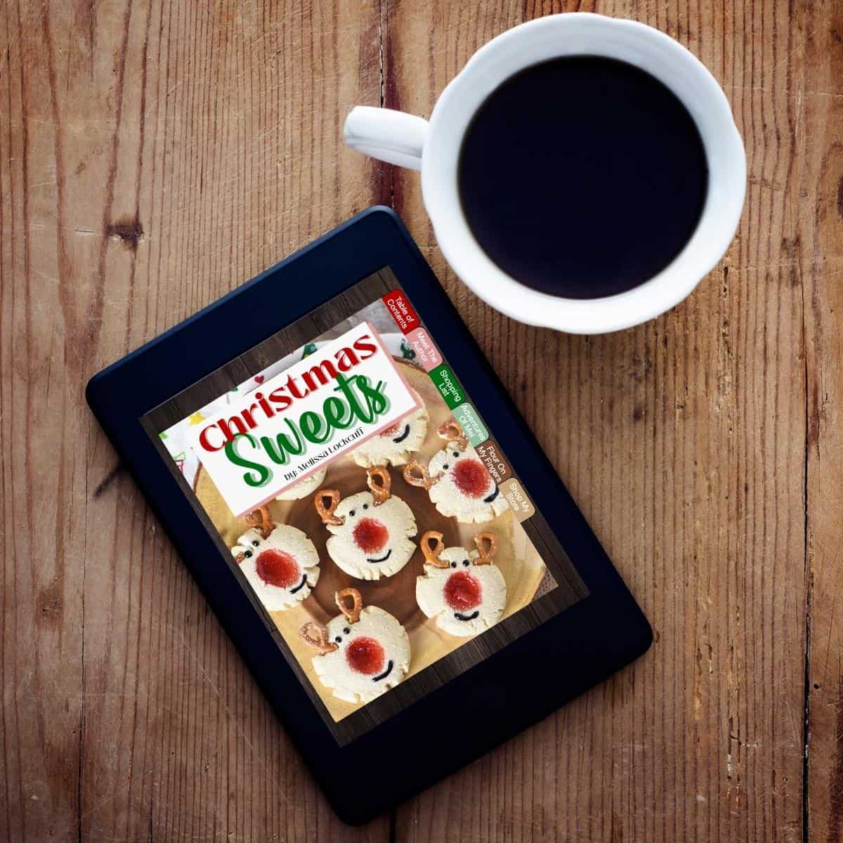 Christmas Sweets digital cookbook on tablet with cup of coffee