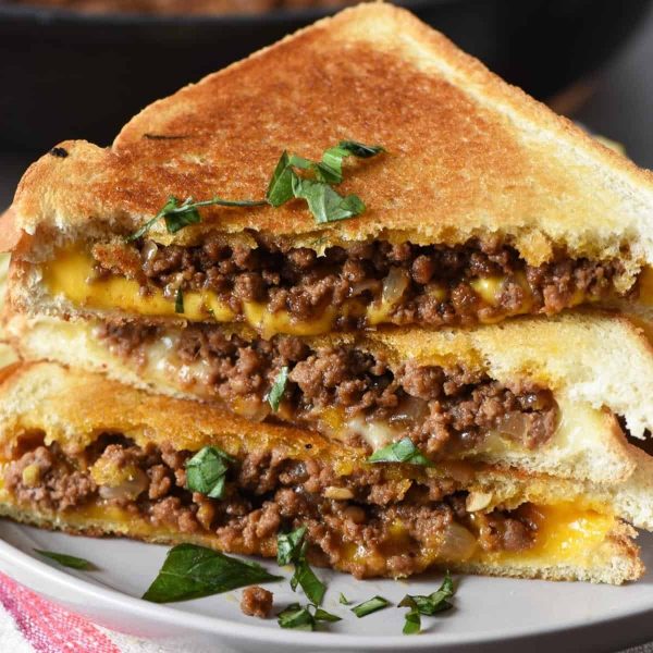 grilled cheese sloppy joes in stack on gray plate