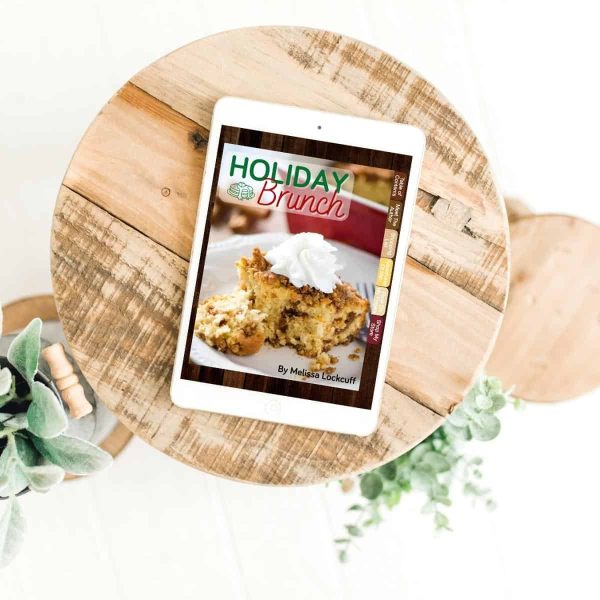 Holiday Brunch cookbook on tablet on round wooden cutting board
