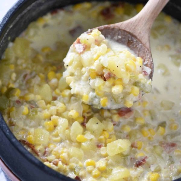 spoonful of potato corn chowder over Dutch oven