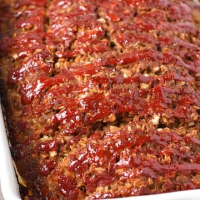 oatmeal meatloaf with ketchup in a large white baking dish