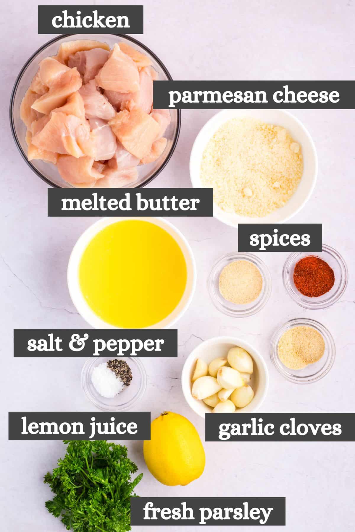 garlic parmesan chicken skewers ingredients lined out on a bright white countertop