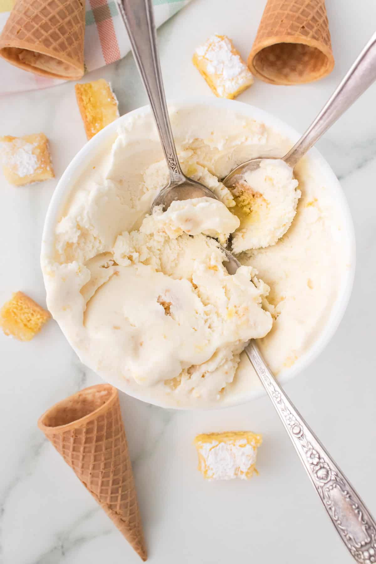 homemade gooey butter cake ice cream with spoons in ice cream container