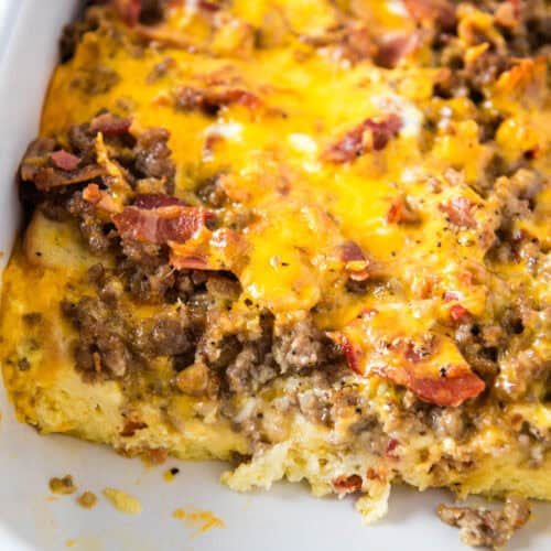 sliced cheesy Texas toast breakfast casserole in white baking dish