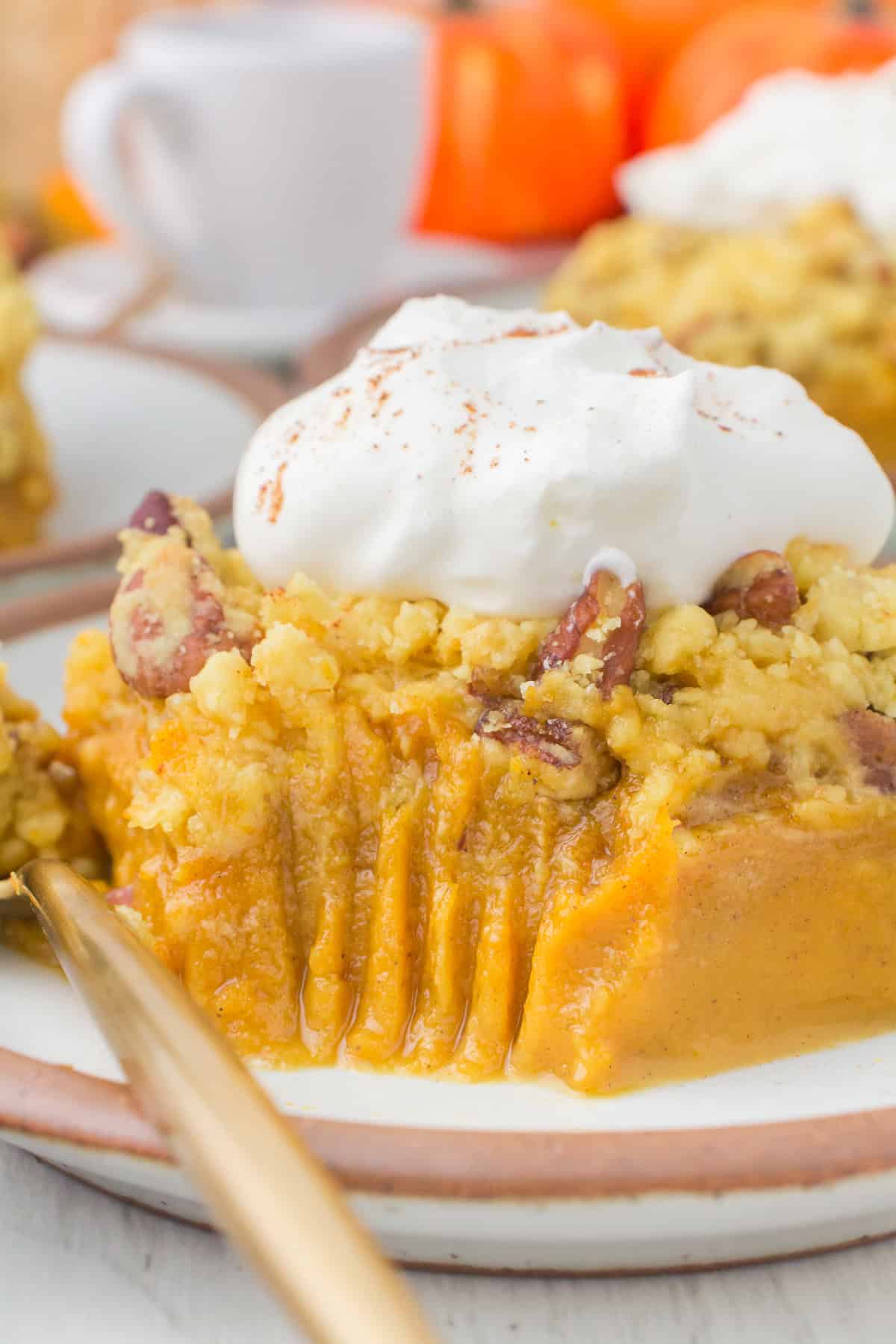 up close pumpkin dessert with yellow cake mix with bite taken
