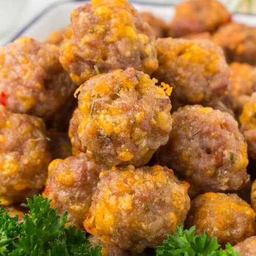 Bisquick sausage cheese balls piled up in a large glass container