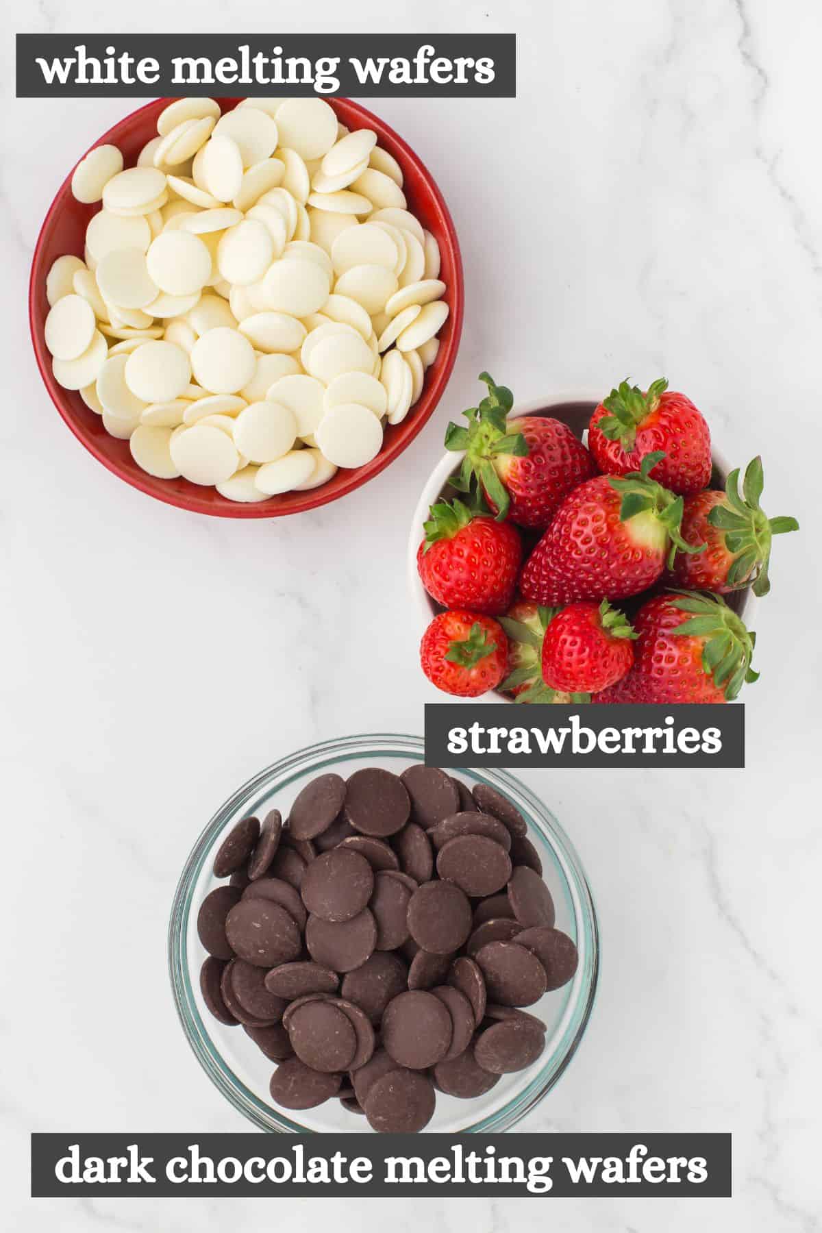 chocolate covered strawberries ingredients lined out on a white marbled countertop