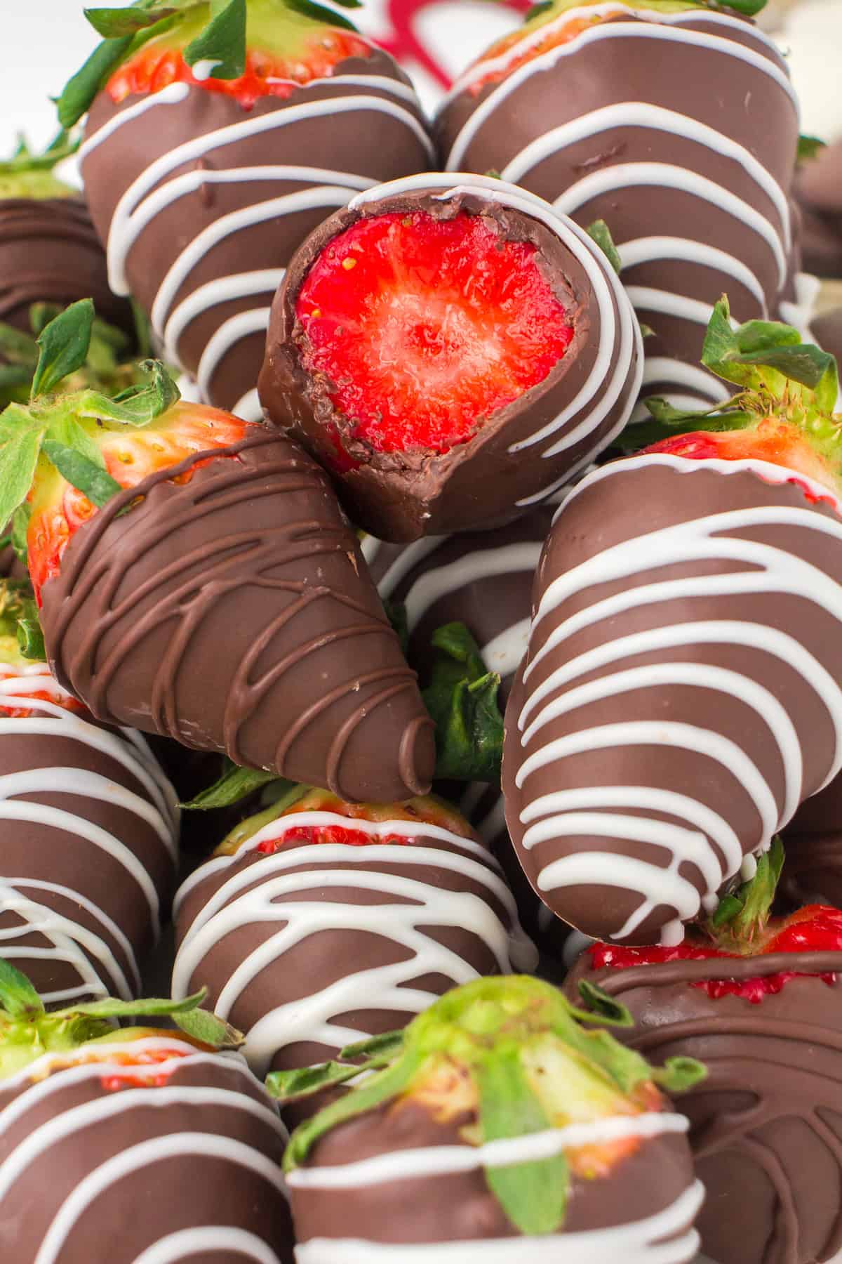 chocolate dipped strawberries with a bite taken out