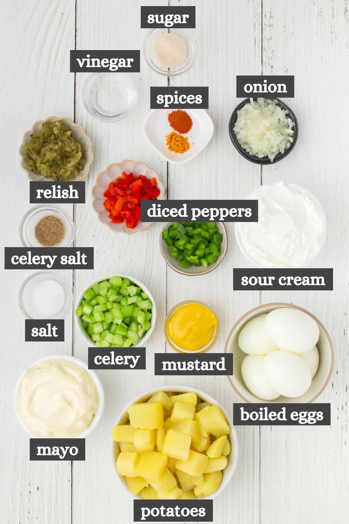 deviled egg potato salad ingredients lined out on a white countertop