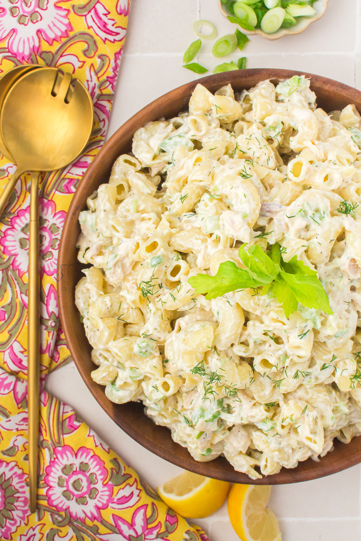 creamy tuna pasta salad in a brown wooden bowl