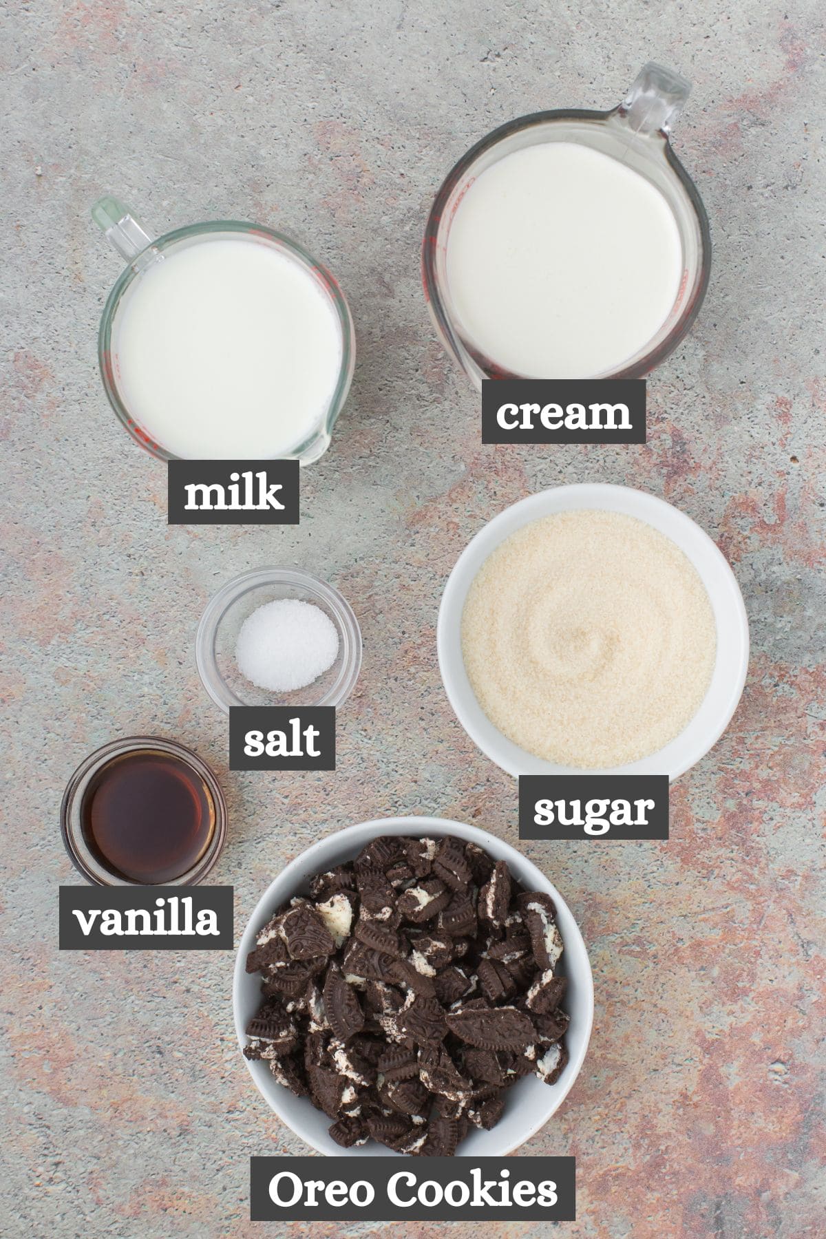homemade cookies and cream ice cream ingredients lined out on a gray countertop
