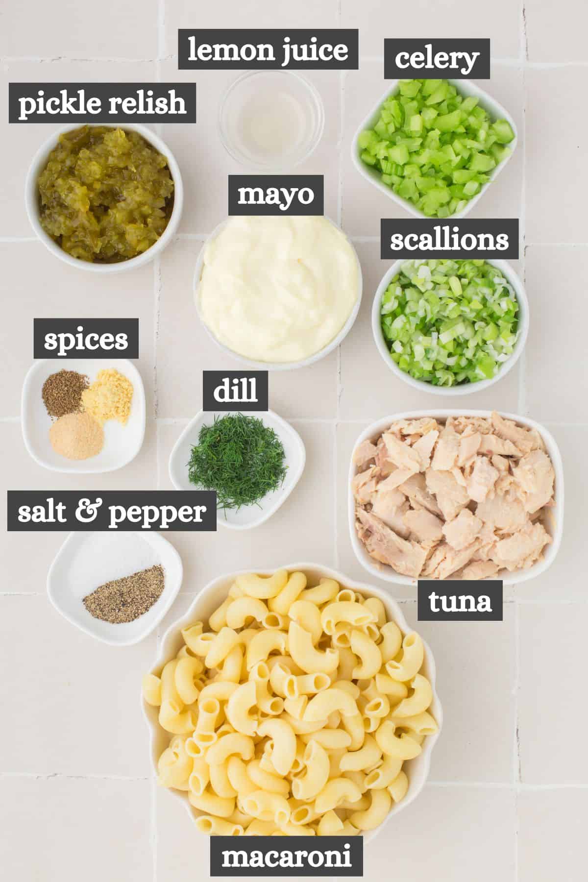 tuna macaroni salad ingredients lined out on a white countertop