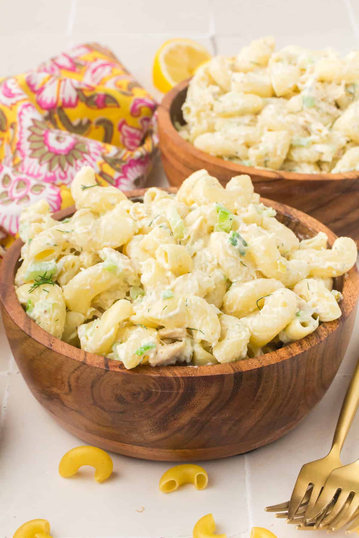 tuna fish macaroni salad in a brown wooden bowl