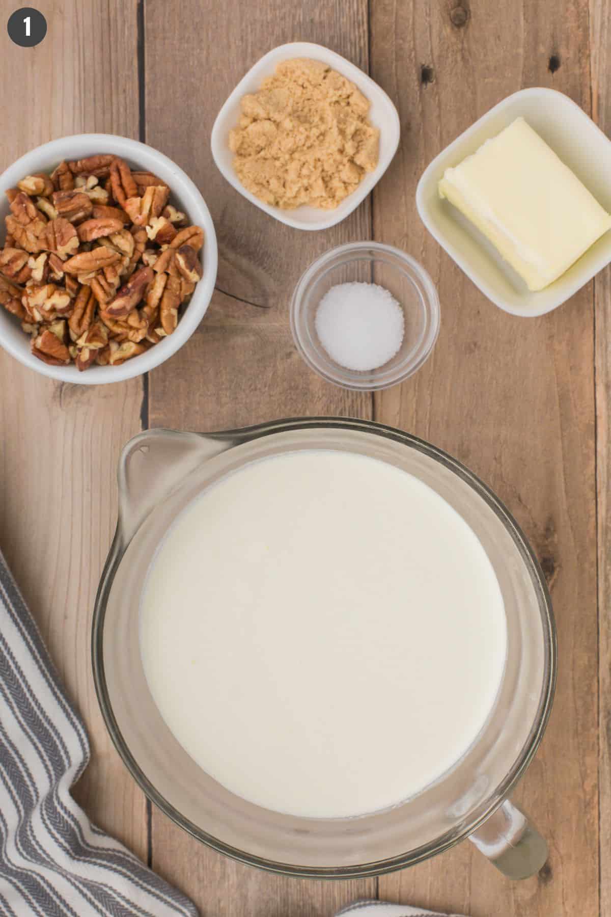 ingredients lined out on a wooden countertop to make the best eggless butter pecan ice cream recipe