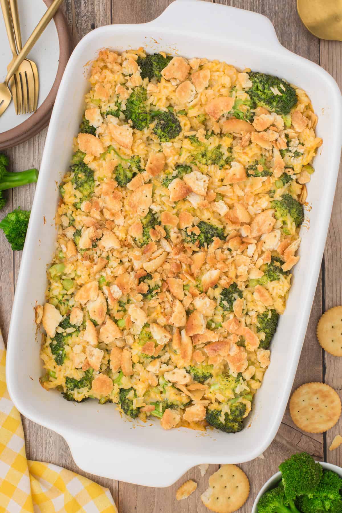 overhead shot showing broccoli cheese rice casserole in a large white 9x13 baking dish