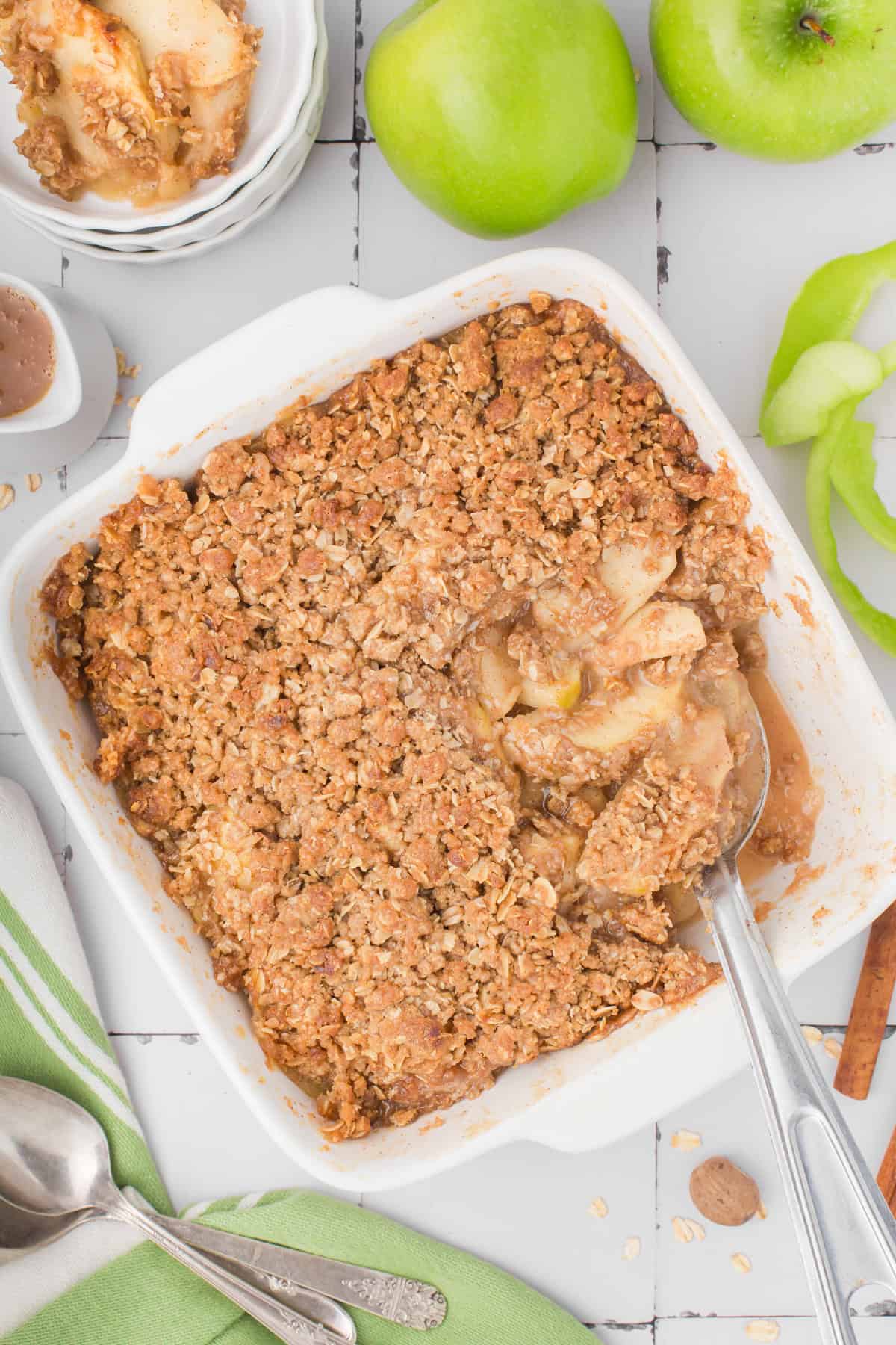 overhead shot showing classic apple crisp with oats in a square white baking dish