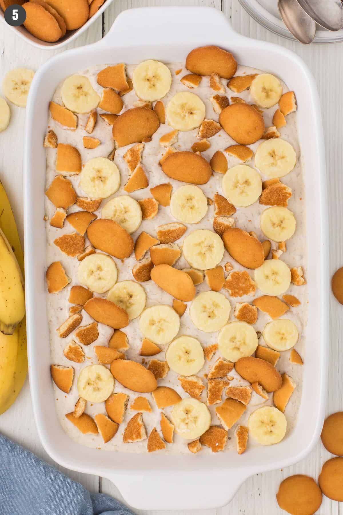 overhead shot showing no bake banana pudding in a white 9x13 casserole dish